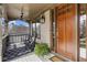 Cozy covered front porch with rocking chairs, a ceiling fan, and a wooden front door, perfect for relaxing at 1214 Oglethorpe Ne Ave, Brookhaven, GA 30319