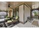 Covered front porch with comfortable seating, creating an inviting outdoor space with views to the outside at 1214 Oglethorpe Ne Ave, Brookhaven, GA 30319
