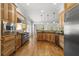 Spacious kitchen with hardwood floors, wood cabinets, stainless steel appliances, and granite countertops at 1214 Oglethorpe Ne Ave, Brookhaven, GA 30319