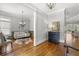 Elegant living room with hardwood floors, detailed trim, stylish furniture, and an open floor plan at 1214 Oglethorpe Ne Ave, Brookhaven, GA 30319