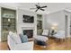 Inviting living room with fireplace, built-in shelves, and ample seating at 1214 Oglethorpe Ne Ave, Brookhaven, GA 30319