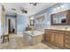 Spacious bathroom features double vanities, a standalone soaking tub and tile flooring at 1214 Oglethorpe Ne Ave, Brookhaven, GA 30319