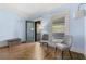 Bright main bedroom features hardwood floors, and a door opening to an outdoor balcony at 1214 Oglethorpe Ne Ave, Brookhaven, GA 30319