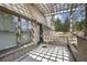 A shaded patio with brick accents and a view of the lush backyard at 1214 Oglethorpe Ne Ave, Brookhaven, GA 30319