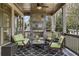 Relaxing covered patio with comfortable seating and an outdoor fireplace at 1214 Oglethorpe Ne Ave, Brookhaven, GA 30319