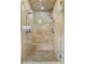 The tile shower features dual shower heads, a built-in bench, and a glass door at 1214 Oglethorpe Ne Ave, Brookhaven, GA 30319