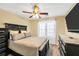 Comfortable bedroom featuring a ceiling fan and a window that provides natural light at 170 Fairview Chase Rd, Covington, GA 30016