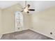 Neutral bedroom with vaulted ceiling, ceiling fan, and a window that provides natural light at 170 Fairview Chase Rd, Covington, GA 30016