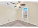 Neutral bedroom with vaulted ceiling, ceiling fan, and a window that provides natural light at 170 Fairview Chase Rd, Covington, GA 30016