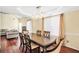 Formal dining room with wood floors, elegant lighting, and neutral paint at 170 Fairview Chase Rd, Covington, GA 30016