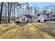 Well-maintained single-story home with a two-car garage and mature trees in the yard at 170 Fairview Chase Rd, Covington, GA 30016