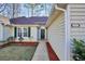 Inviting front entrance with well-maintained landscaping and charming 'welcome outdoors' sign at 170 Fairview Chase Rd, Covington, GA 30016