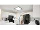 Bright kitchen featuring white cabinets, black appliances, and modern fixtures at 170 Fairview Chase Rd, Covington, GA 30016
