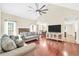 Bright and airy living room with vaulted ceilings, hardwood floors, and a stone fireplace at 170 Fairview Chase Rd, Covington, GA 30016