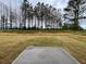 Backyard features a small concrete patio and an open grassy area at 202 Groveton Ct, Euharlee, GA 30145