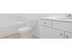 Clean, all-white bathroom featuring a modern vanity and a combined tub and shower at 202 Groveton Ct, Euharlee, GA 30145