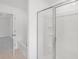 Bathroom with a tub, shower, and tile floor, bathed in soft, natural light at 202 Groveton Ct, Euharlee, GA 30145