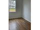 Bedroom featuring hardwood floor and a window with a view at 202 Groveton Ct, Euharlee, GA 30145