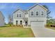Charming two-story home features a two-car garage, well-manicured lawn, and classic architectural design at 202 Groveton Ct, Euharlee, GA 30145