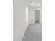 Upstairs hall with gray carpet and access to laundry room at 202 Groveton Ct, Euharlee, GA 30145