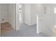 Upstairs hall features gray carpet, white trim, and laundry room access at 202 Groveton Ct, Euharlee, GA 30145