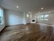 Spacious living room featuring a fireplace, hardwood floors, recessed lighting, and natural light at 202 Groveton Ct, Euharlee, GA 30145