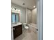 Well-lit bathroom with a shower-tub, modern vanity, and tile flooring at 3166 Morris Hills Dr, Dacula, GA 30019