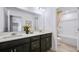 Bathroom featuring dual sinks, a large mirror, and a separate toilet and shower area at 3166 Morris Hills Dr, Dacula, GA 30019
