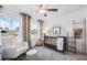 Cozy Bedroom with a crib, chair, and natural light streaming through the windows at 3166 Morris Hills Dr, Dacula, GA 30019