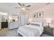 Bedroom featuring charming pink walls, ceiling fan, and plush carpeting at 3166 Morris Hills Dr, Dacula, GA 30019