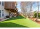 Lush backyard with stairs leading to a cozy upper deck, perfect for outdoor enjoyment at 4240 Agard St, Cumming, GA 30040