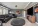 Finished basement features comfortable seating, a large TV, and room for recreation at 4240 Agard St, Cumming, GA 30040