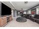 Basement with a big TV, full seating, hardwood entertainment center, and a casual beanbag at 4240 Agard St, Cumming, GA 30040