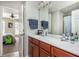 Bathroom features double vanity and view of bedroom, creating a spacious feel at 4240 Agard St, Cumming, GA 30040