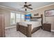 Comfortable bedroom with a bed, bedside table, and windows that provide natural light at 4240 Agard St, Cumming, GA 30040