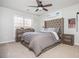 Comfortable bedroom with a large bed, ample natural light, and stylish decor at 4240 Agard St, Cumming, GA 30040