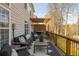 Spacious backyard deck features comfortable seating, a grill, and an outdoor rug perfect for entertaining and relaxing at 4240 Agard St, Cumming, GA 30040