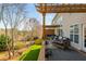 Outdoor deck with furniture, a hot tub, and beautiful views, perfect for relaxation and entertaining at 4240 Agard St, Cumming, GA 30040