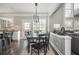 A dining area sits in between the living room and eat-in kitchen areas of the home at 4240 Agard St, Cumming, GA 30040