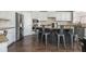 Spacious kitchen island with seating, stainless steel appliances, and granite countertops at 4240 Agard St, Cumming, GA 30040