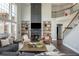 Cozy living room with tall ceilings, fireplace, built-in shelves, and comfortable seating area at 4240 Agard St, Cumming, GA 30040