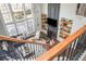 Bright living room with a fireplace, built-in shelves, hardwood floors, and a large window at 4240 Agard St, Cumming, GA 30040