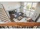 Open living room with a large sectional sofa, hardwood floors, and lots of natural light at 4240 Agard St, Cumming, GA 30040