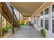 Covered patio with access to backyard and home, featuring outdoor lighting and comfortable seating at 4240 Agard St, Cumming, GA 30040