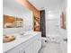 Well-lit bathroom featuring a large vanity, decorative art, and a shower-tub combination with a curtain at 227 Groveton Ct, Euharlee, GA 30145