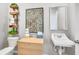Charming half bathroom with decorative accents, modern fixtures, and a unique vanity setup at 227 Groveton Ct, Euharlee, GA 30145