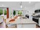 Open-concept kitchen featuring a spacious island with seating and stainless steel appliances, perfect for entertaining at 227 Groveton Ct, Euharlee, GA 30145