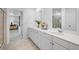 Elegant bathroom featuring dual sinks, ample counter space, and a view into the bedroom at 227 Groveton Ct, Euharlee, GA 30145