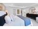 Elegant main bedroom featuring a plush bed, decorative pillows, and ample closet space, offering comfort and style at 227 Groveton Ct, Euharlee, GA 30145