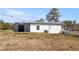 A view of a home's backyard featuring a shed, grass, and exterior details at 3384 Nebo Rd, Dallas, GA 30157